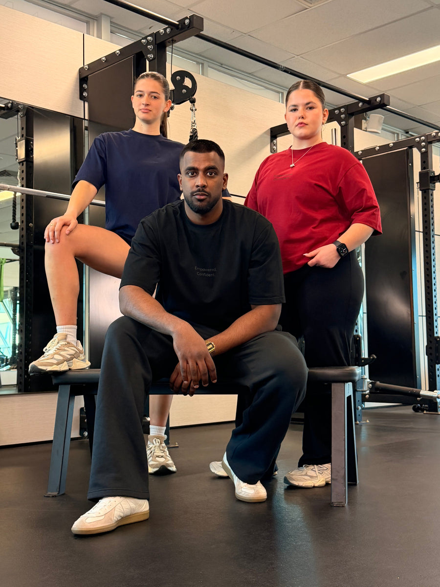 Group in Core Form Apparel tees sitting together in the gym